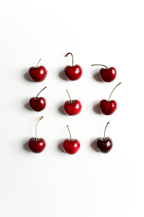 Red Cherries on White Surface