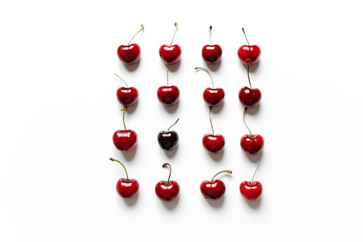 Red Cherries On White Surface