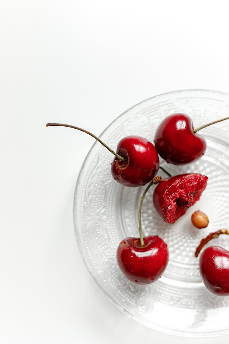 Red Cherries On Glass Plate