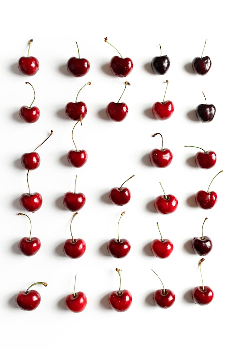 Red Cherries On White Background