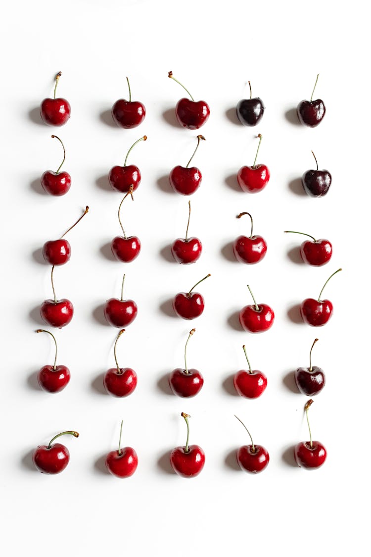 Photo Of Cherries On White Surface