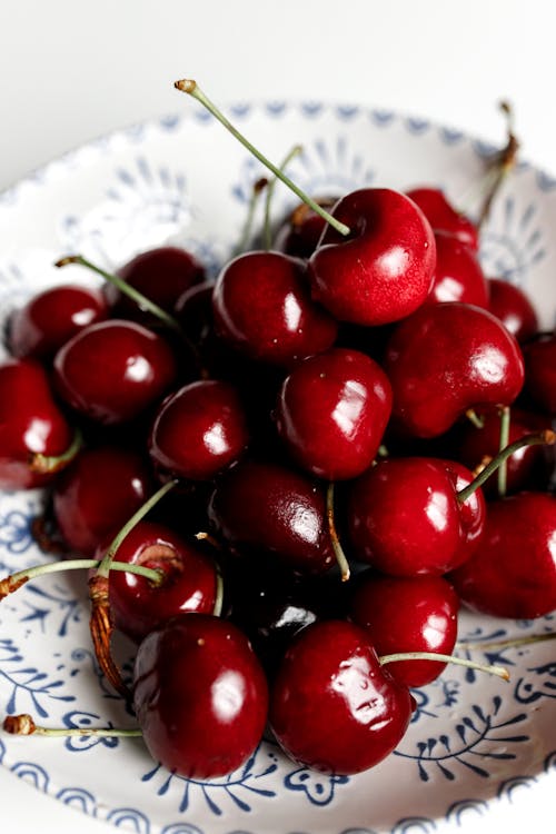 Close Up Photo of Cherries on a Plate