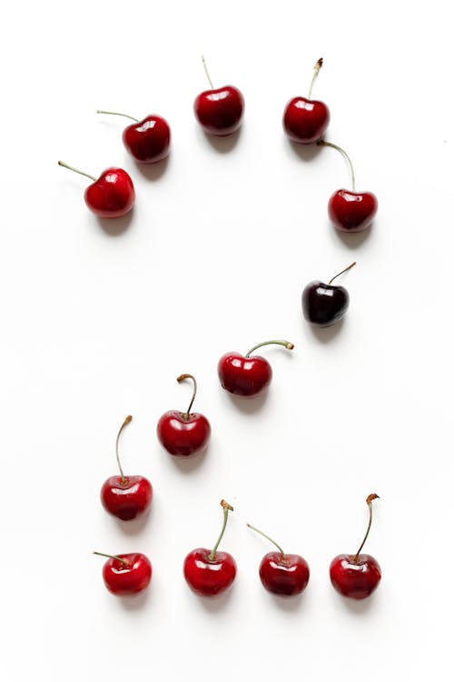 Red Cherries on White Surface