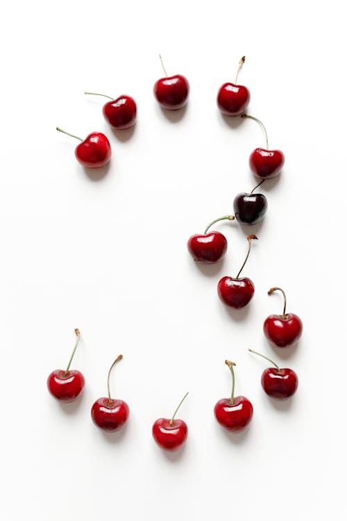 Red Ripe Cherries on White Surface
