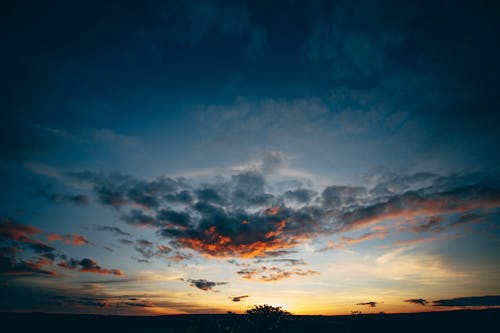 Vibrant sunset over meadow in evening