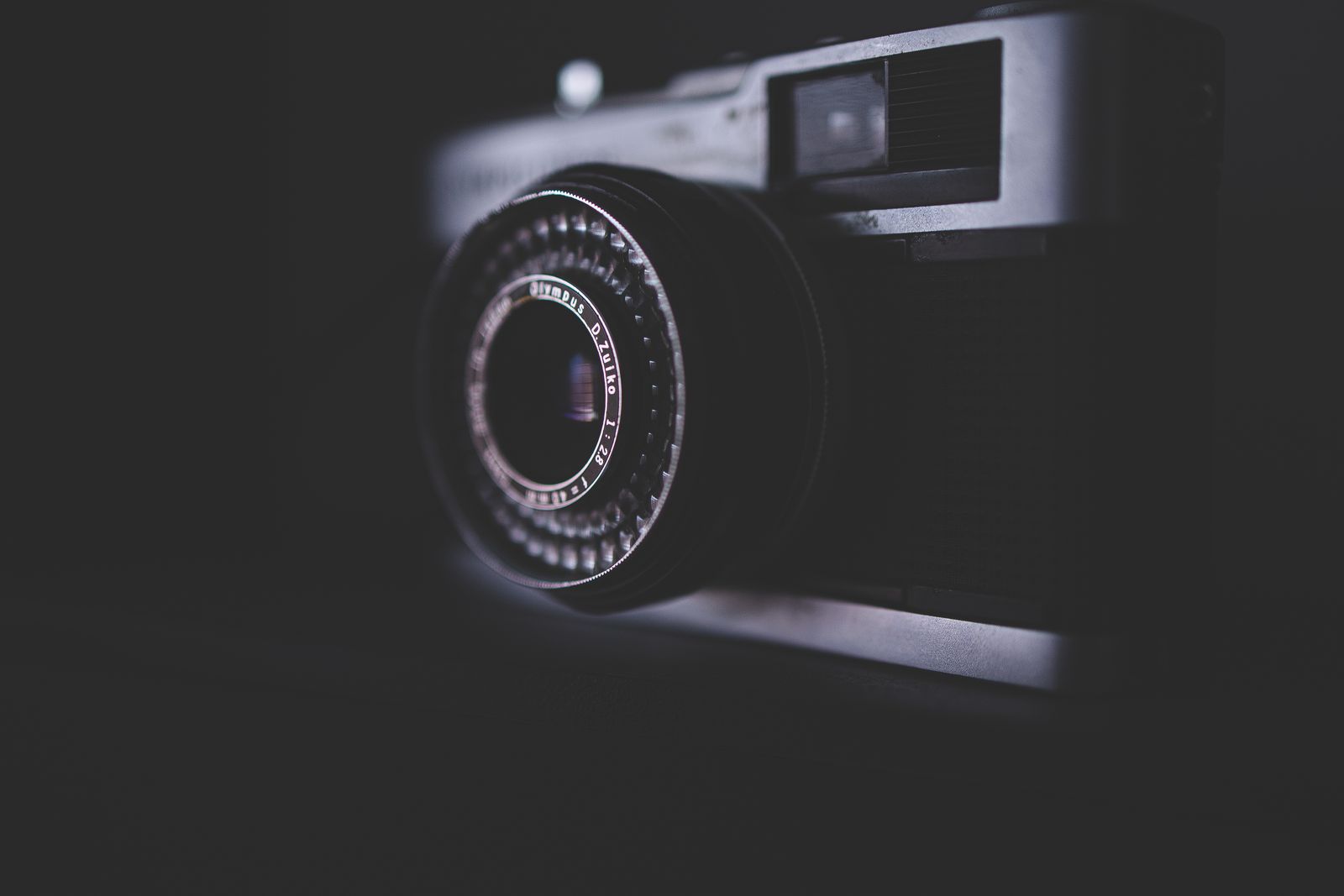 Vintage film camera against a black background
