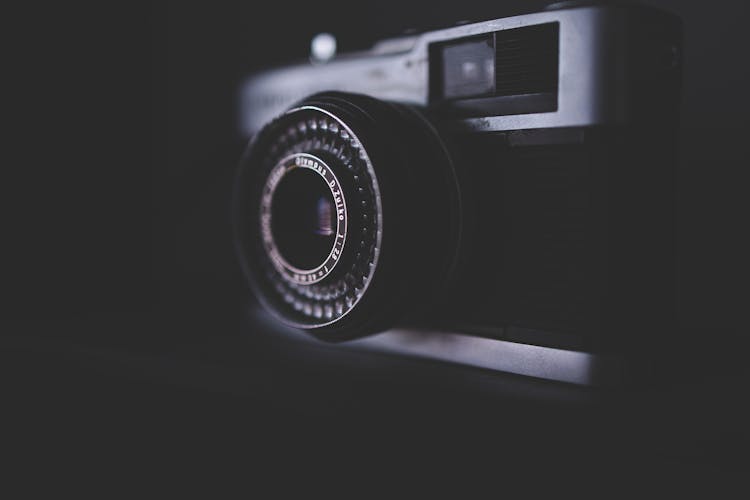 Vintage Photo Camera Against Black Background