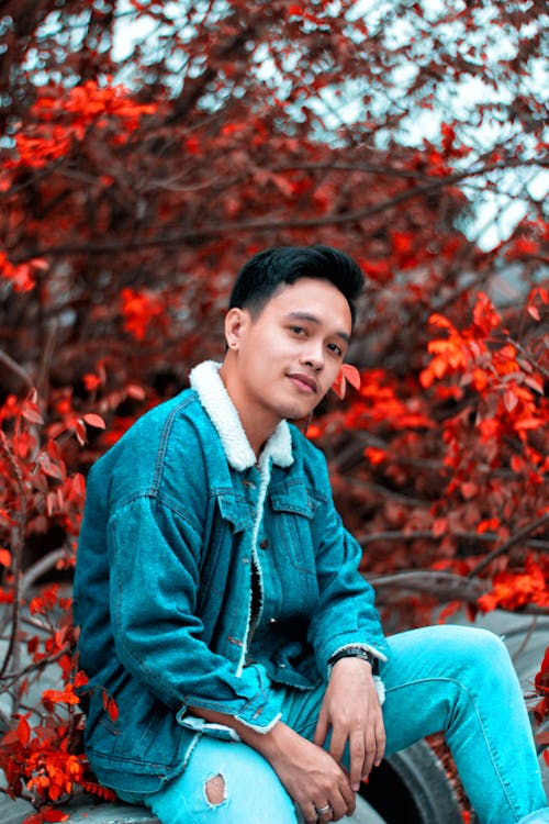 Photo of a Man in Denim Clothes Looking at the Camera