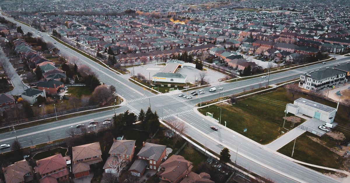An Aerial Photography of a Road Intersection Near the Houses · Free ...