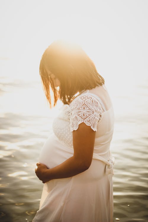 Pregnant Woman At Sunset