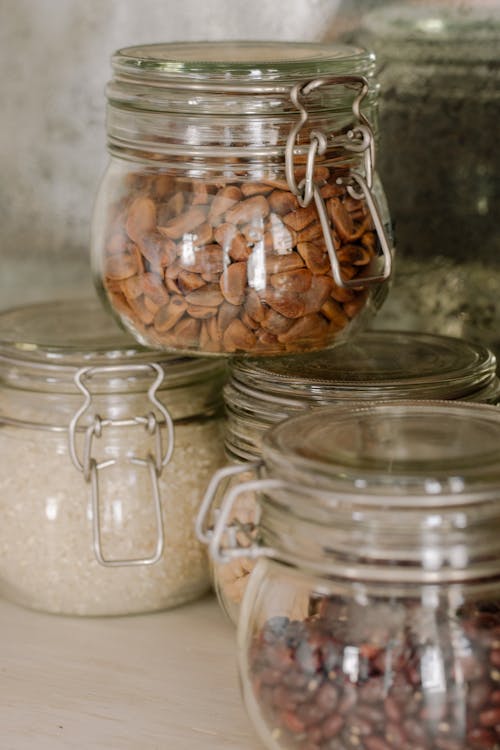 Clear Glass Jars With Brown and White Stones