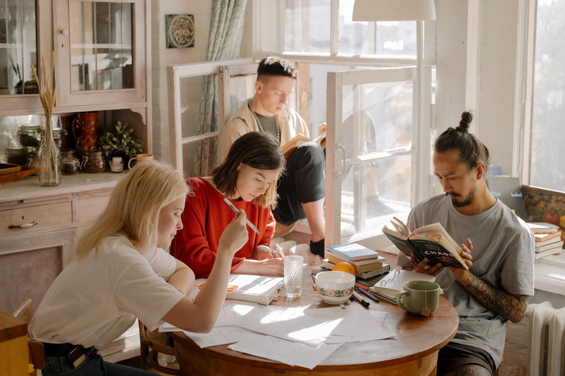 Four people sitting at a table together