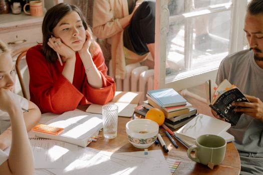 Woman in Red Long Sleeve Shirt Sitting on Chair