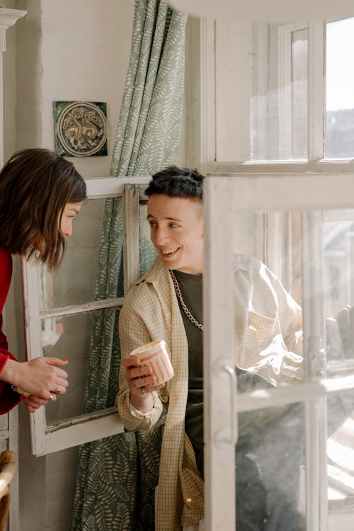 Woman in Gray Sweater Holding White Ceramic Mug