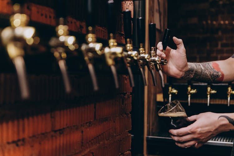 Man Pouring A Beer