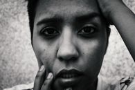 Emotionally expressive monochrome portrait of a woman, close-up.