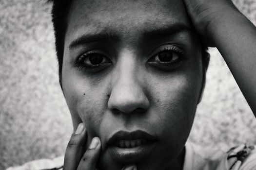 Emotionally expressive monochrome portrait of a woman, close-up.