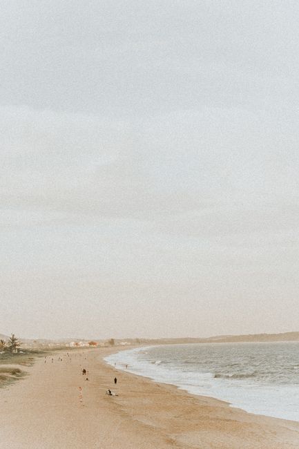 A serene beach scene with gentle waves and vast open sky, perfect for relaxation.