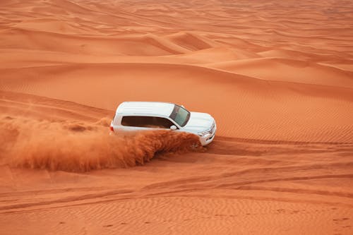 White Vehicle driving on the Desert