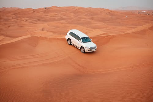 Free White Car on the Desert Stock Photo