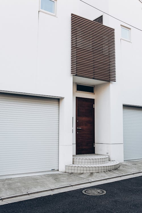 Free Apartment Building with Wooden Front Door Stock Photo