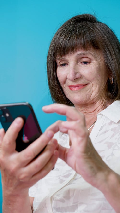 Elderly Woman Busy Texting