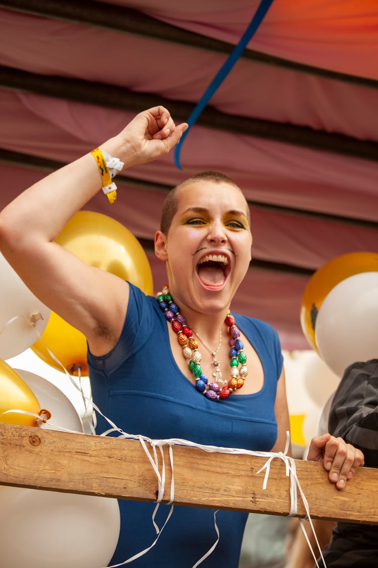 Woman Cheering And Holding Her Arm Up