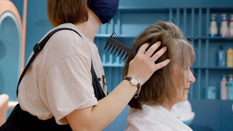 Hairdresser Styling A Client's Hair