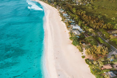 Aerial View of Beach with Blue Water