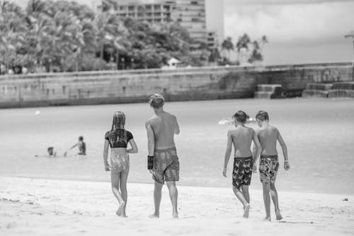 Free Back View of Teenagers on Beach Stock Photo