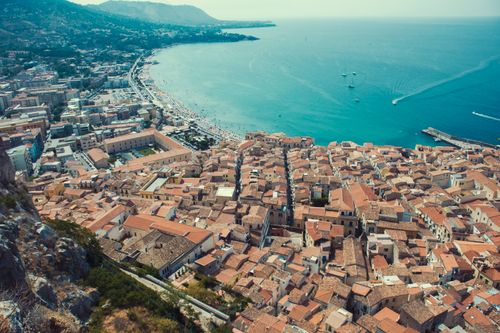 Free Explore the stunning aerial view of Cefalù, Sicily with its historic architecture and vibrant coastline along the Tyrrhenian Sea. Stock Photo