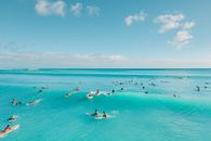 Idyllic View of People Swimming in Turquoise Sea