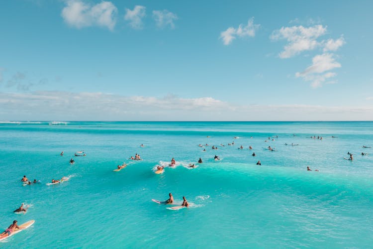 Idyllic View Of People Swimming in Turquoise Sea