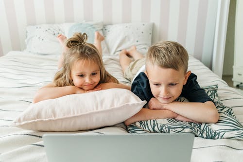 Siblings Watching on a Laptop