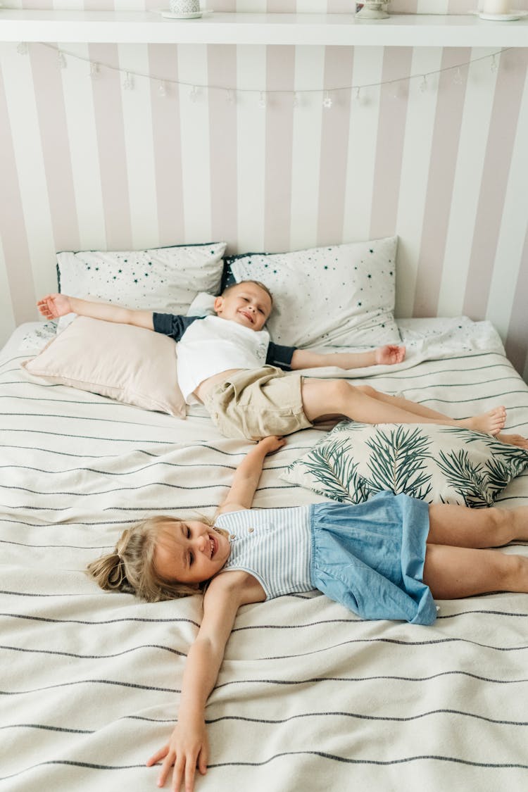 Kids Lying On The Bed