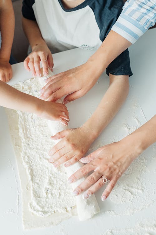 Persons Feet on White Ceramic Bathtub