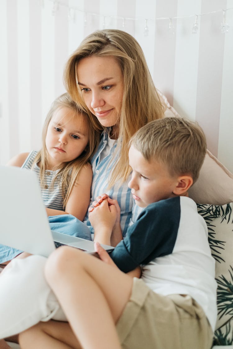 A Family Watching On Laptop