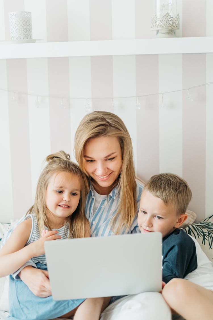 A Happy Family Watching On Laptop