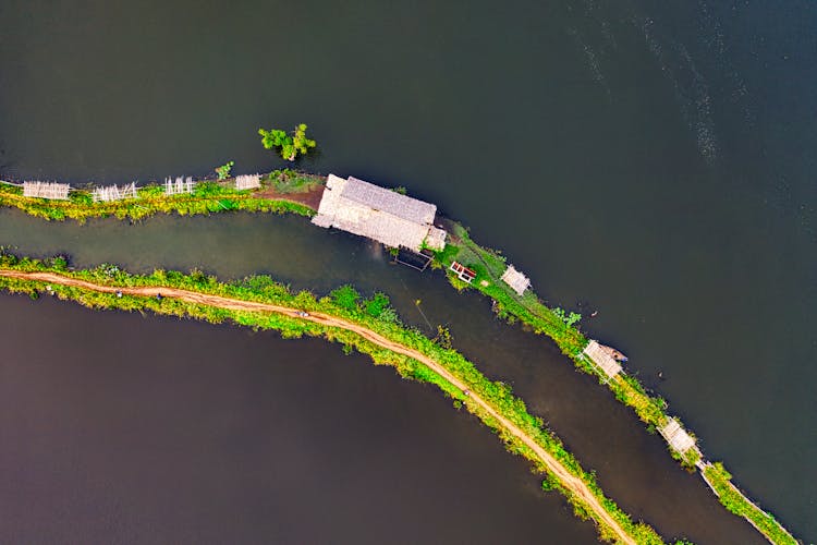 Top View Of A House And Road On A Tiny Island 