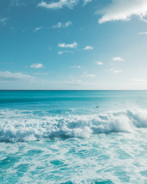 Ocean Waves Under Blue Sky