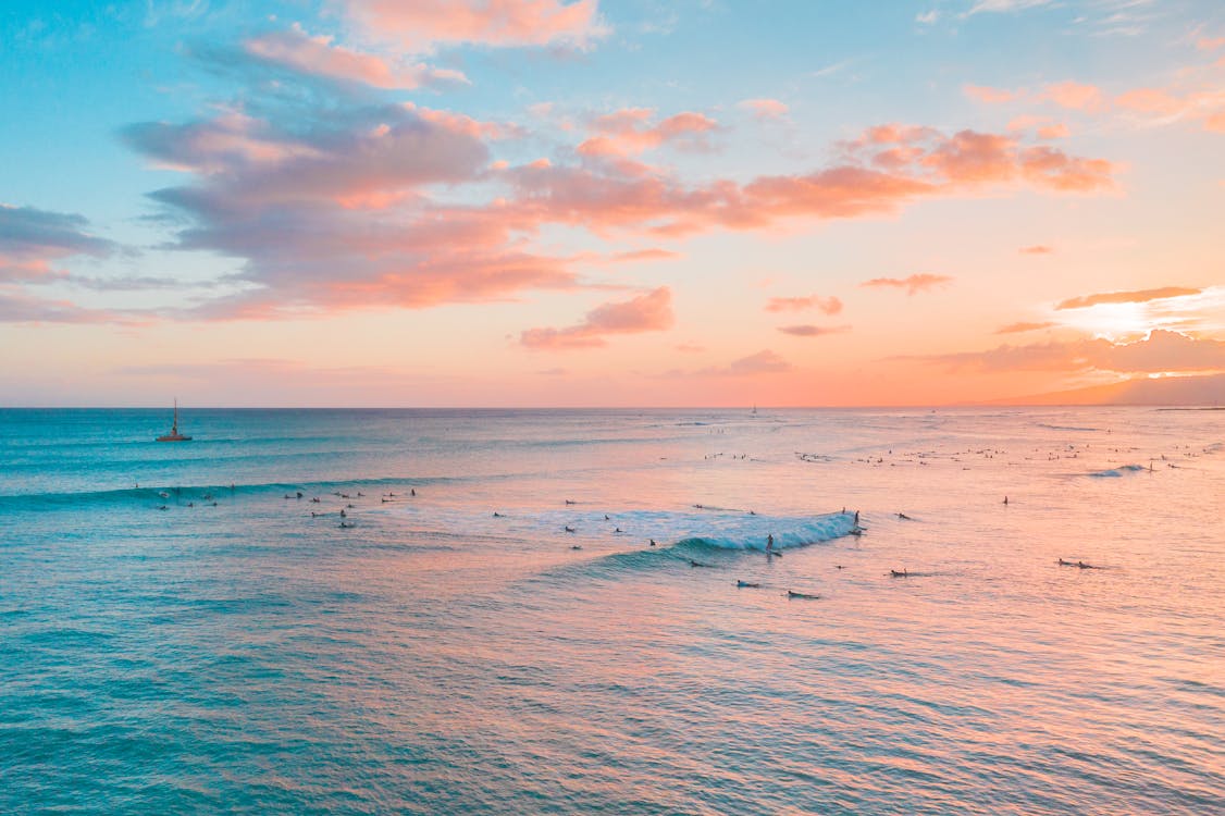 Free Body of Water Under Cloudy Blue Sky Stock Photo