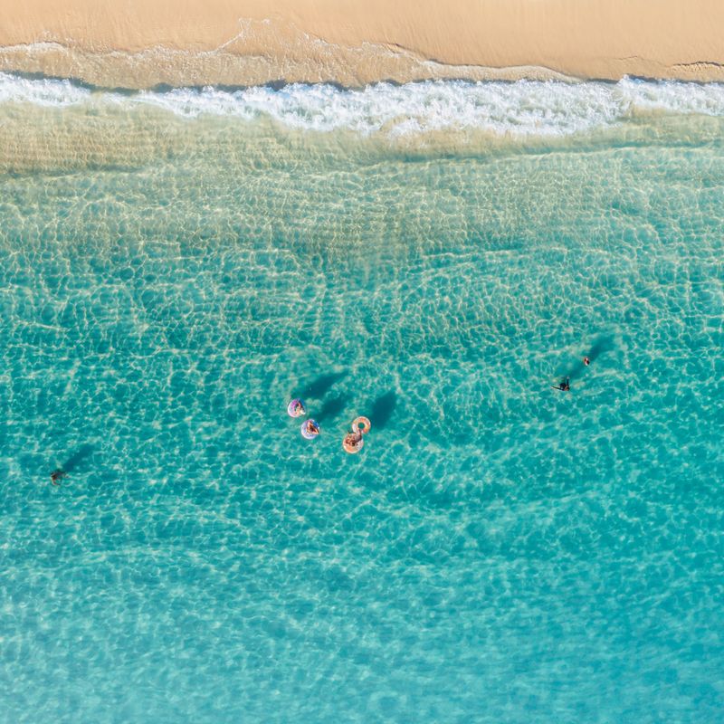 harbour demos cover art — aerial shoreline, photo by Jess Loiterton on Pexels