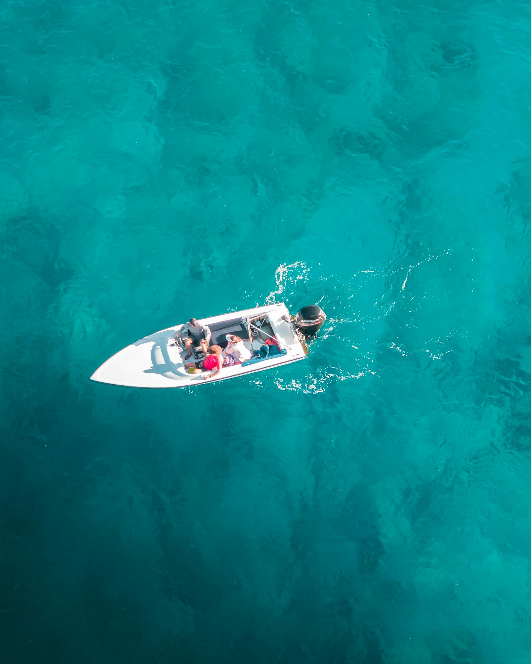 People in a Boat on Blue Waters