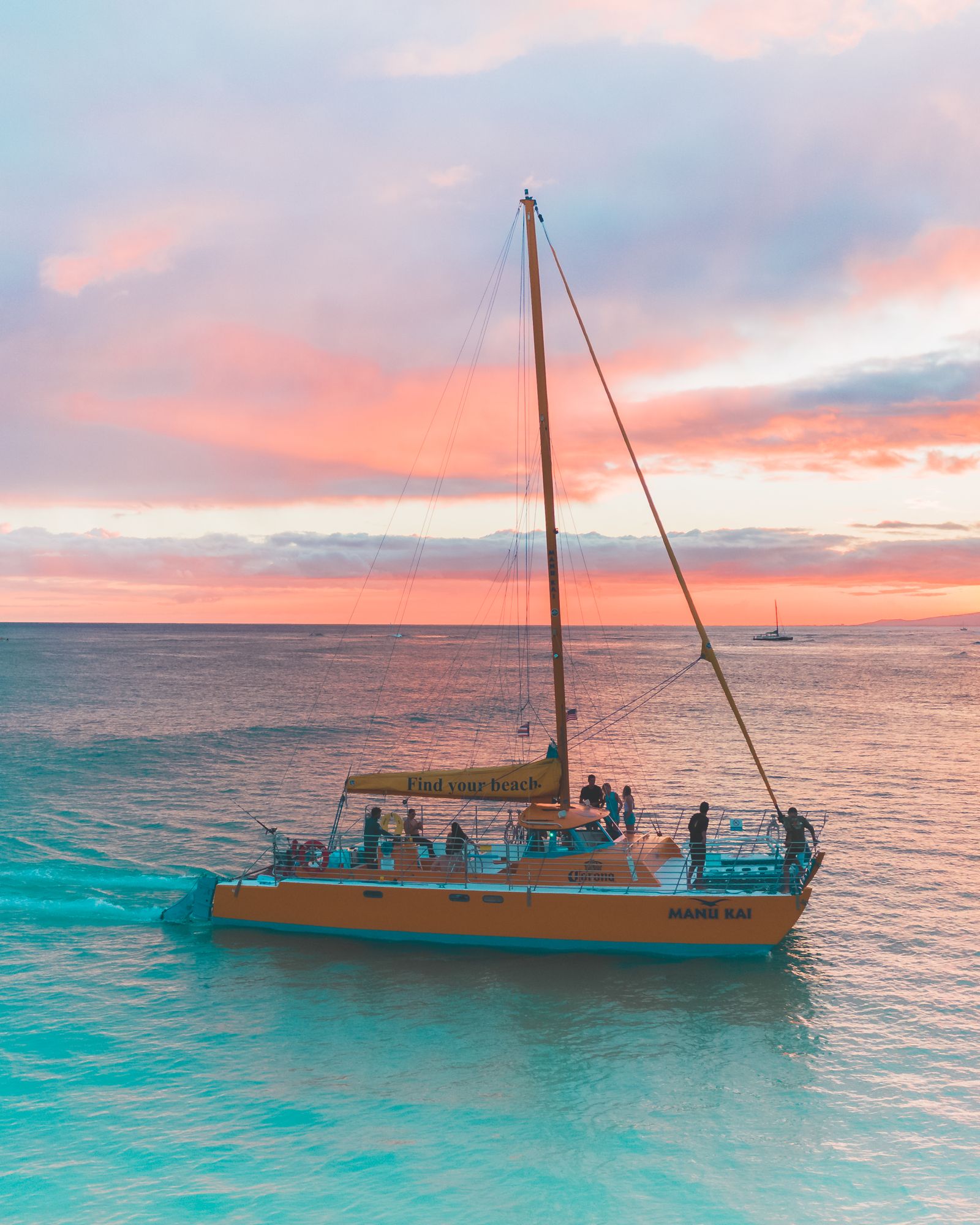 A boat sailing across open turquoise water