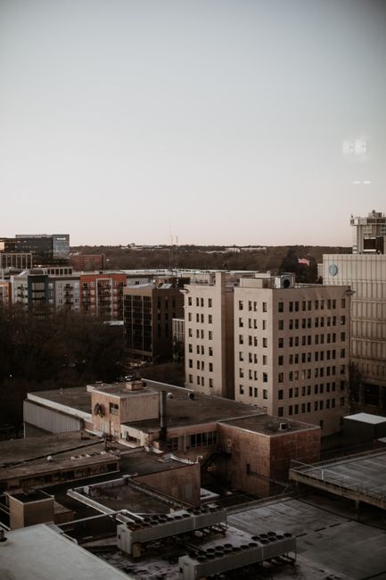 Aerial view of Raleigh's urban architecture and skyline at dusk reflecting the city's growth.