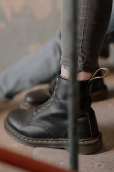 Applying leather conditioner to Doc Martens