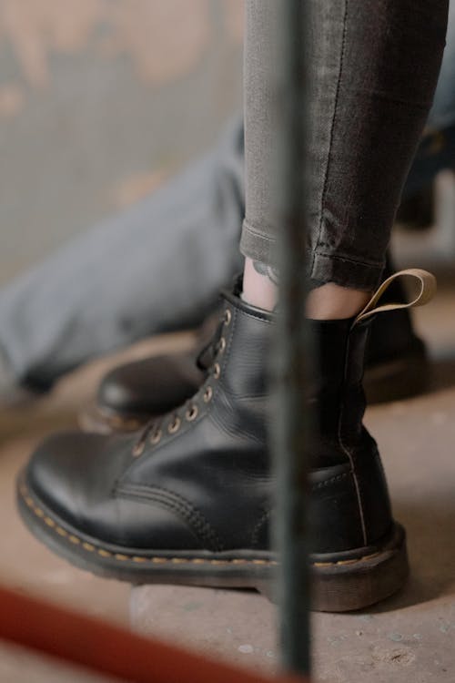 Free Person Wearing Black Leather Boots Stock Photo