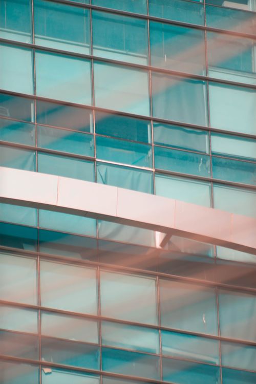 Free Close-up of modern glass building facade in Karachi, emphasizing architectural design. Stock Photo