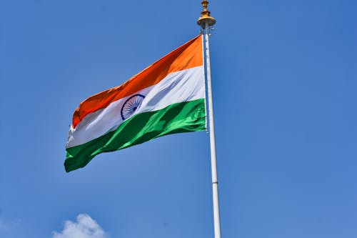 Free Indian Flag against Blue Sky Stock Photo