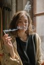 Girl in Black Crew Neck Shirt Blowing Bubbles